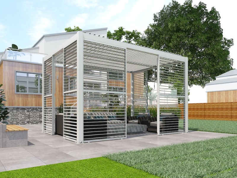 Stylish enclosed pergola with metal slats and comfortable seating area, ideal for backyard gatherings.