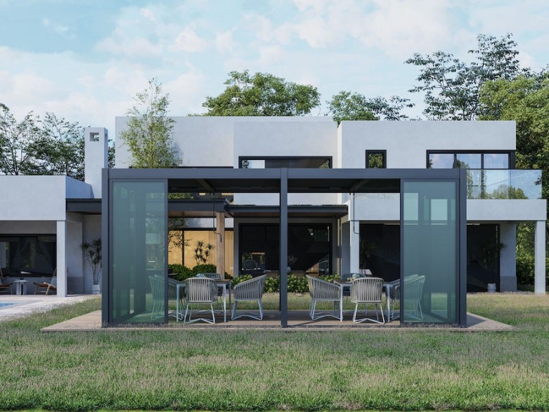 Contemporary pergola with frosted glass panels over dining space in a landscaped garden – how to build a pergola.