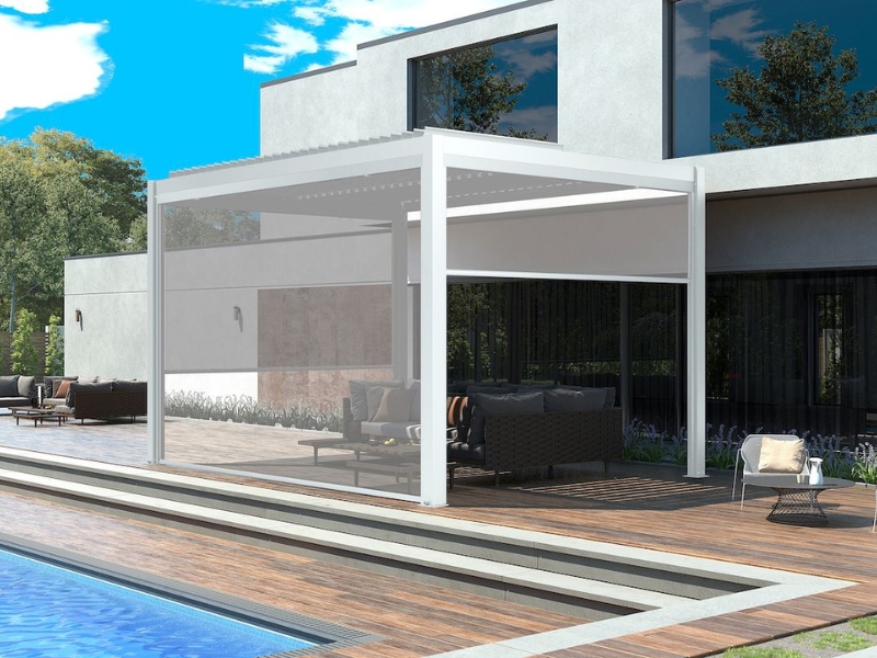 Elegant backyard decks with pergolas, highlighting a white pergola with retractable screens for a shaded outdoor space.