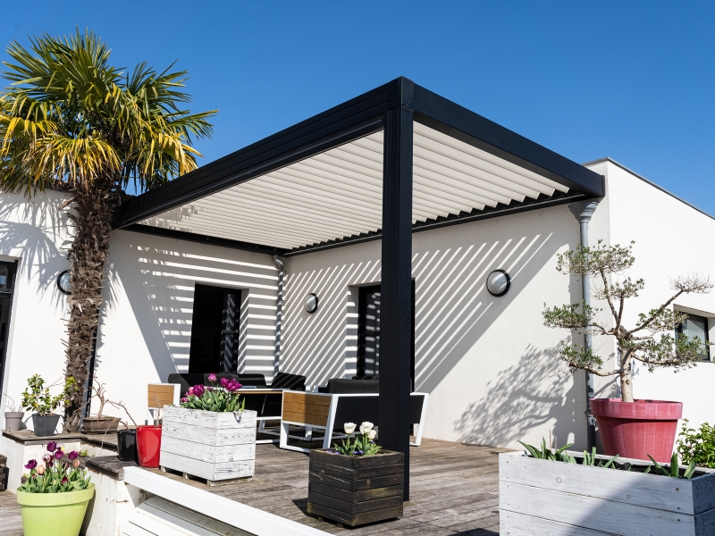 Pergola with adjustable louvres, highlighting durable and stylish options when selecting the best pergola material.