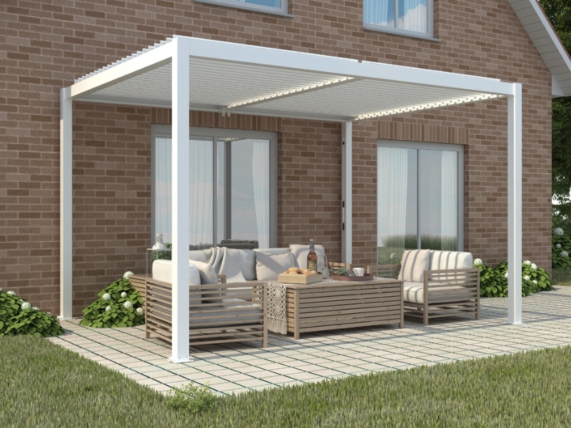 White pergola post with clean lines complementing an outdoor lounge setup in a cosy garden patio.