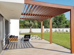 Enhance outdoor space pergola with a wooden slatted design, modern patio furniture, and lush greenery for a stylish retreat.