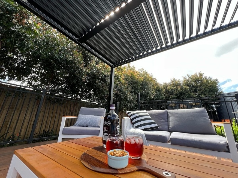 Sagging Pergola avoidance illustrated with sturdy pergola shading outdoor lounge area.