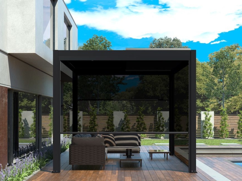 Luxury pergola decking ideas with a sleek black pergola, retractable screens, wooden deck, and modern outdoor furniture for a high-end look.