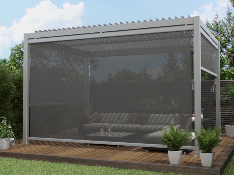 Stylish motorised pergola designs featuring a retractable roof and mesh side screens, ideal for modern outdoor living spaces.