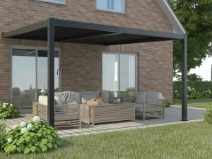 Black adjustable pergola shading outdoor patio with furniture.