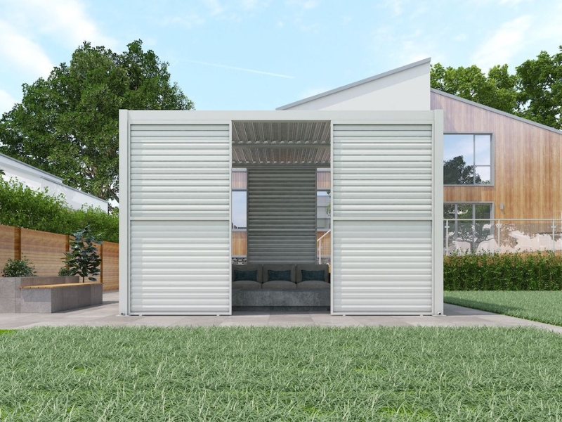 Contemporary aluminium pergola with louvred pergola side panels and built-in seating in a suburban backyard.