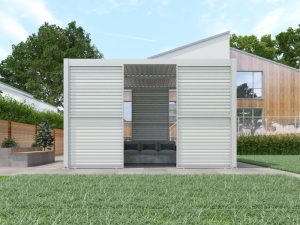 Modern white pergola area with louvred wall panels and outdoor seating in a residential backyard.