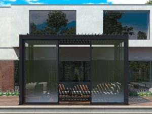Contemporary pergola area with tinted glass sliding doors and dark aluminium frame outside a modern home.