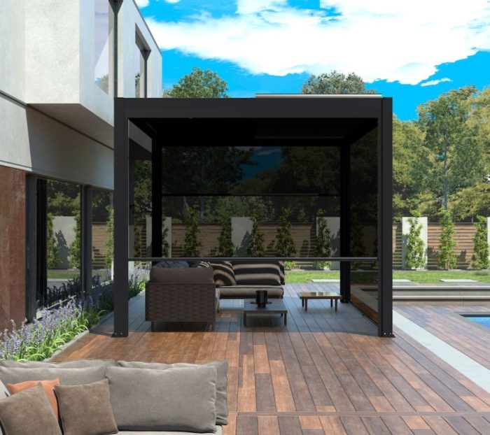Side view of black pergola with automatic pull up screens, providing privacy and sun protection in a stylish outdoor area.