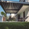 Modern backyard dining area shaded by portable pergola kits with adjustable louvre roof and sleek metal frame