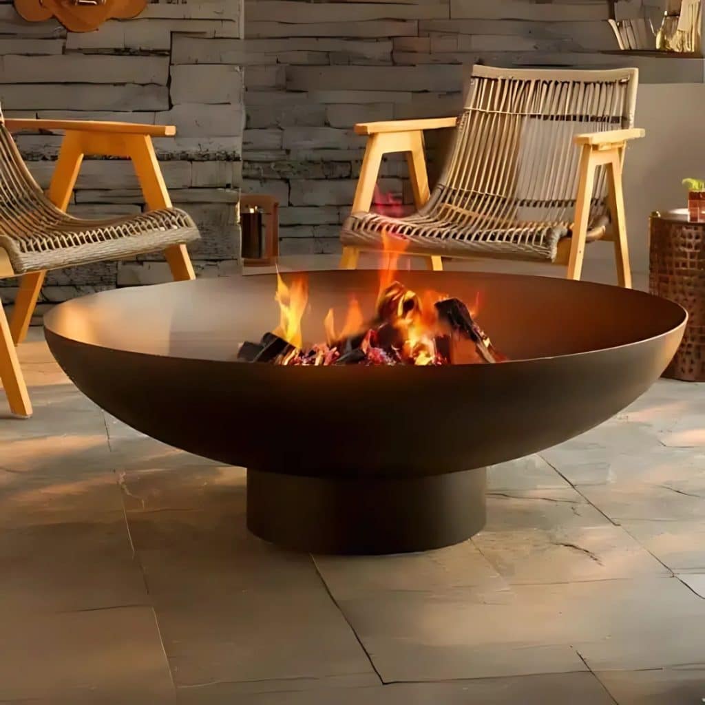Modern outdoor fire pit with burning logs as stylish patio add ons, surrounded by wooden and rope lounge chairs.