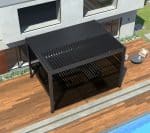 Top view of black pergola with manual pull up screens beside pool, providing adjustable shade and privacy in outdoor space.