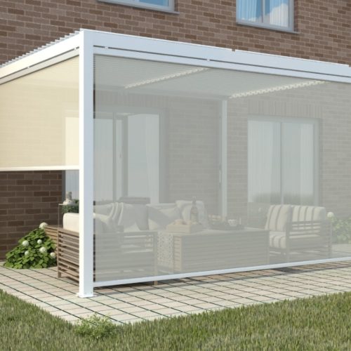 White motorised louvered pergola with clear retractable screens, attached to brick home for stylish weather-protected outdoor living.