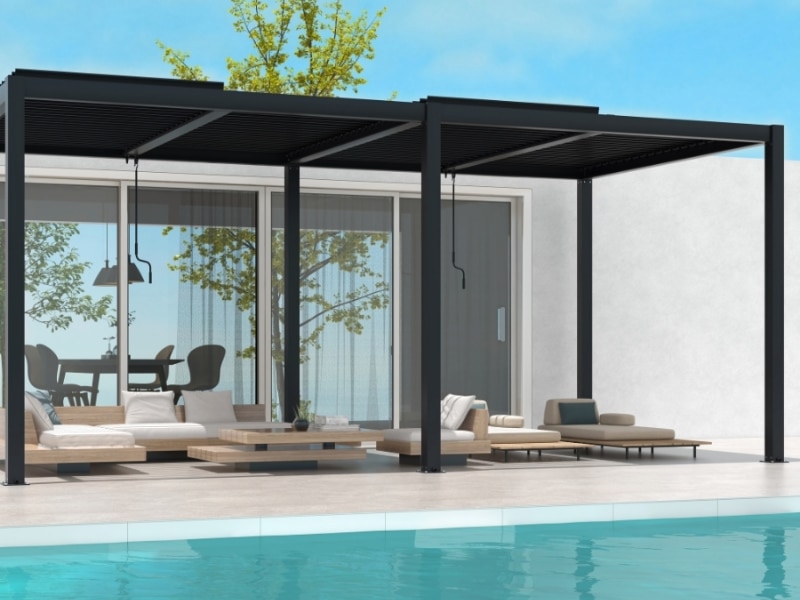 Modern pergola designs and plans with black frame and slatted roof shading poolside lounge area.