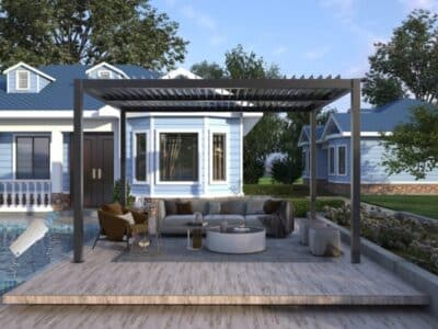 Stylish pergola home design beside a pool with outdoor furniture in front of a blue house.
