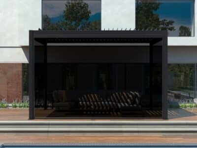 Black modern pergola shading a contemporary outdoor lounge space, highlighting stylish patio pergola ideas.
