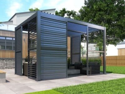 Modern enclosed pergola with outdoor seating and slatted metal panels, showcasing pergola furniture ideas for stylish garden spaces.