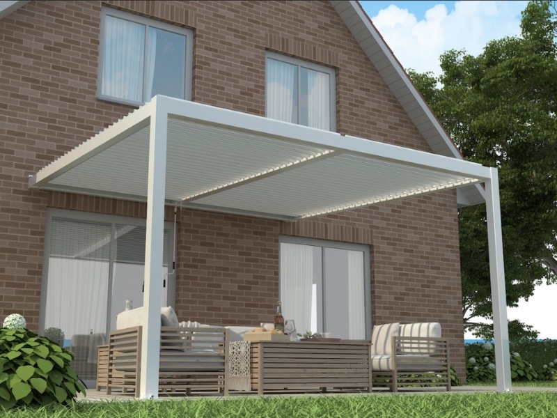 Modern pergola beside brick home illustrating thoughtful pergola layout planning for outdoor seating.