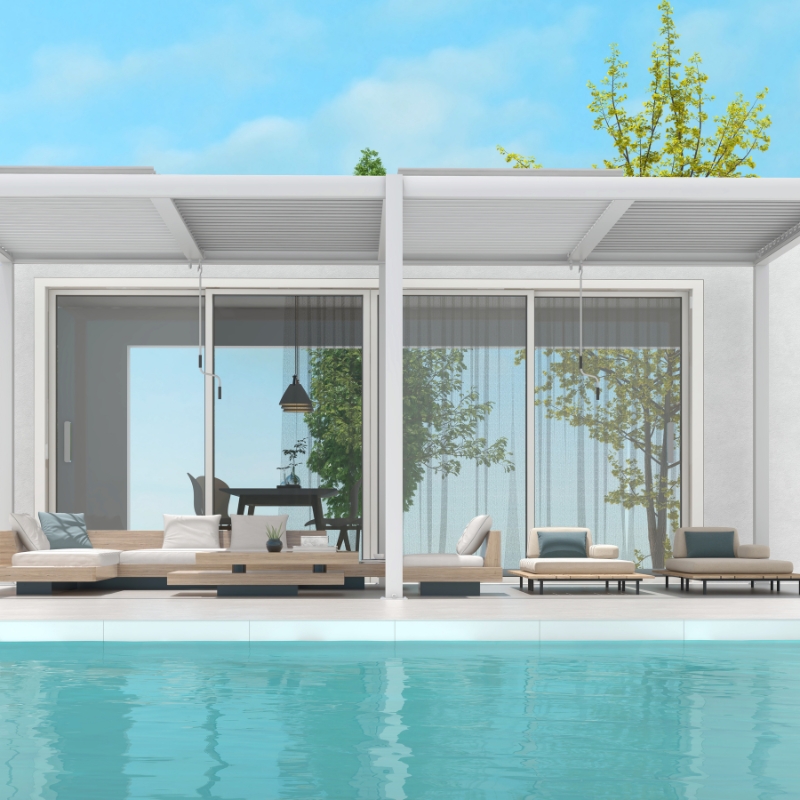 Manual pergolas with adjustable louvered roof beside modern pool patio seating and glass sliding doors.