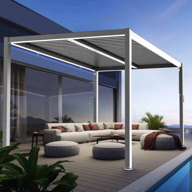 Modern outdoor lounge under white manual pergolas with slatted roof beside glass walls and poolside deck